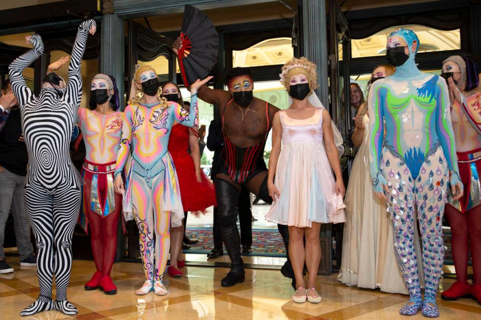 Cast members of "O" arrive for a welcome back parade at Bellagio on Thursday, July 1, ...