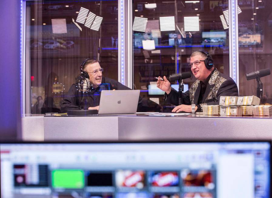 Brent Musburger, left, and Derek Stevens discuss opening round lines during a live broadcast co ...