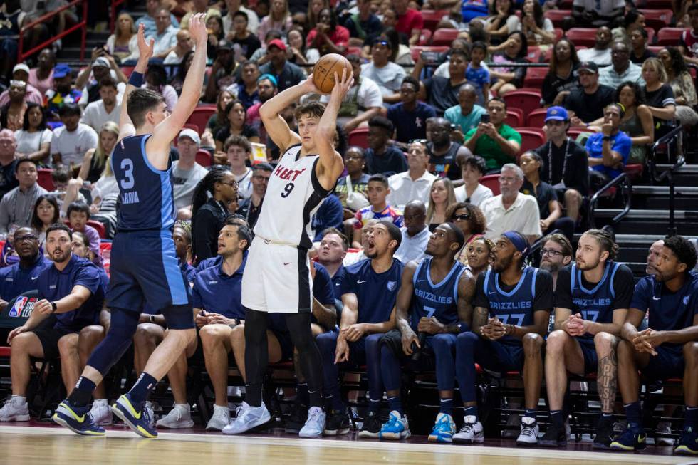 Miami Heat guard Pelle Larsson (9) attempts to throw in the ball during the NBA Summer League C ...