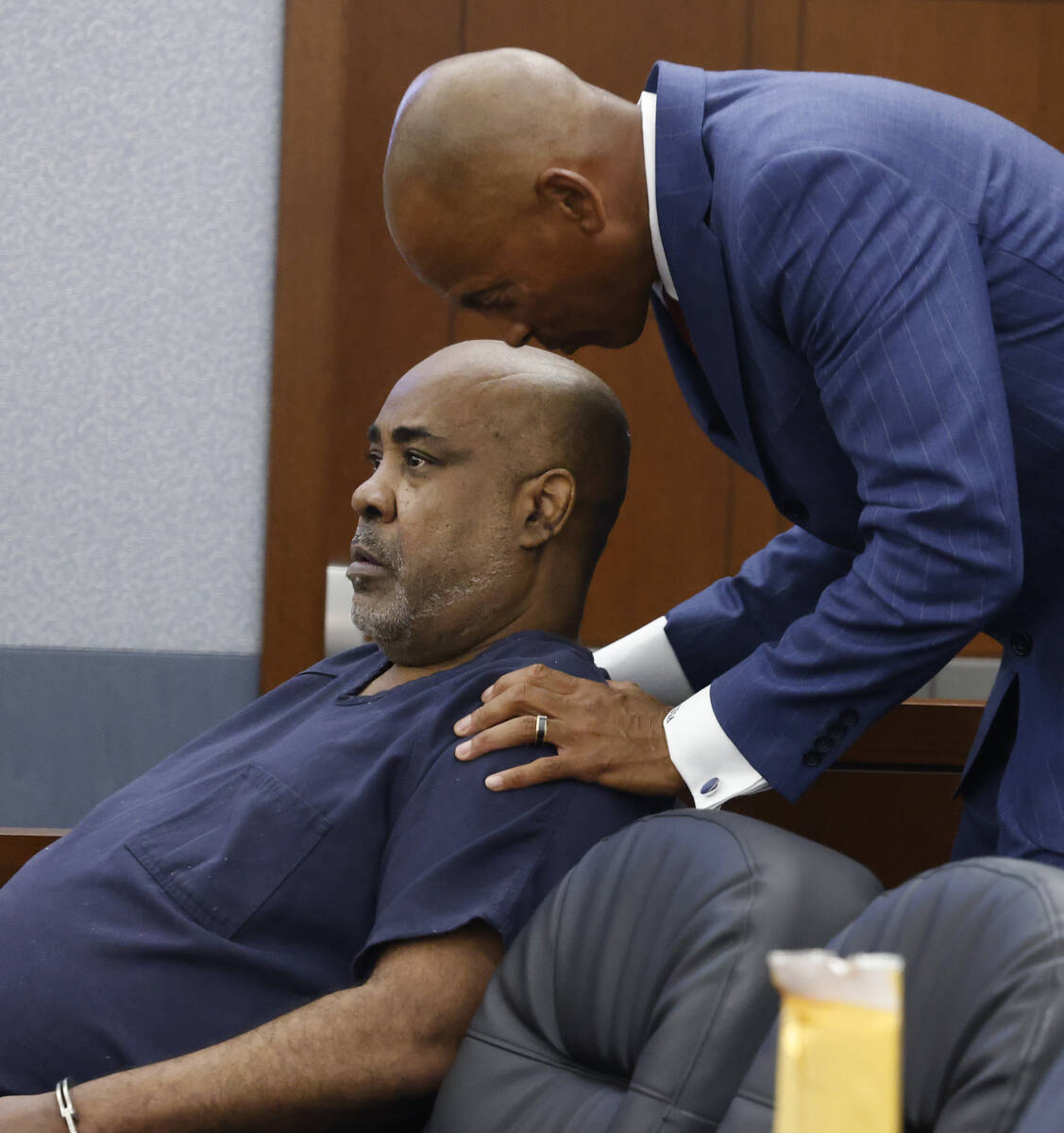 Duane “Keffe D” Davis speaks with his attorney Carl Arnold during a hearing to re ...