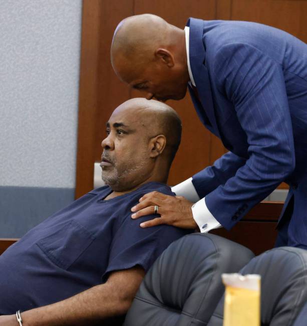 Duane “Keffe D” Davis speaks with his attorney Carl Arnold during a hearing to re ...