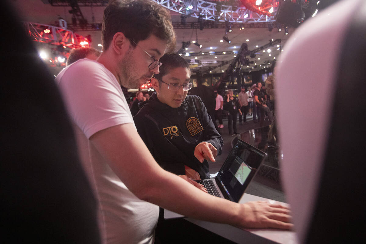 Jonathan Tamayo, right, talks to Dominik Nitsche while competing in the final table of the Worl ...