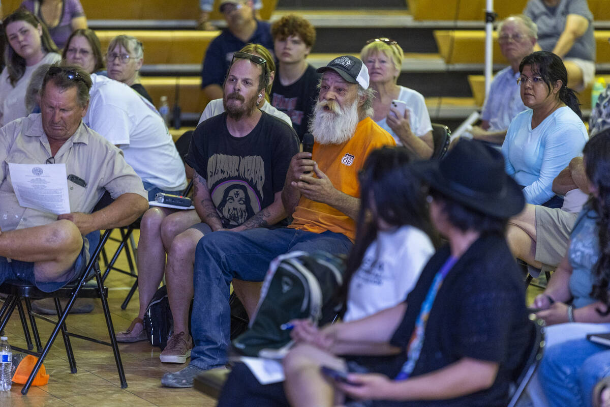 A community member asks a question as Rover Critical Minerals hosts a town hall for residents c ...