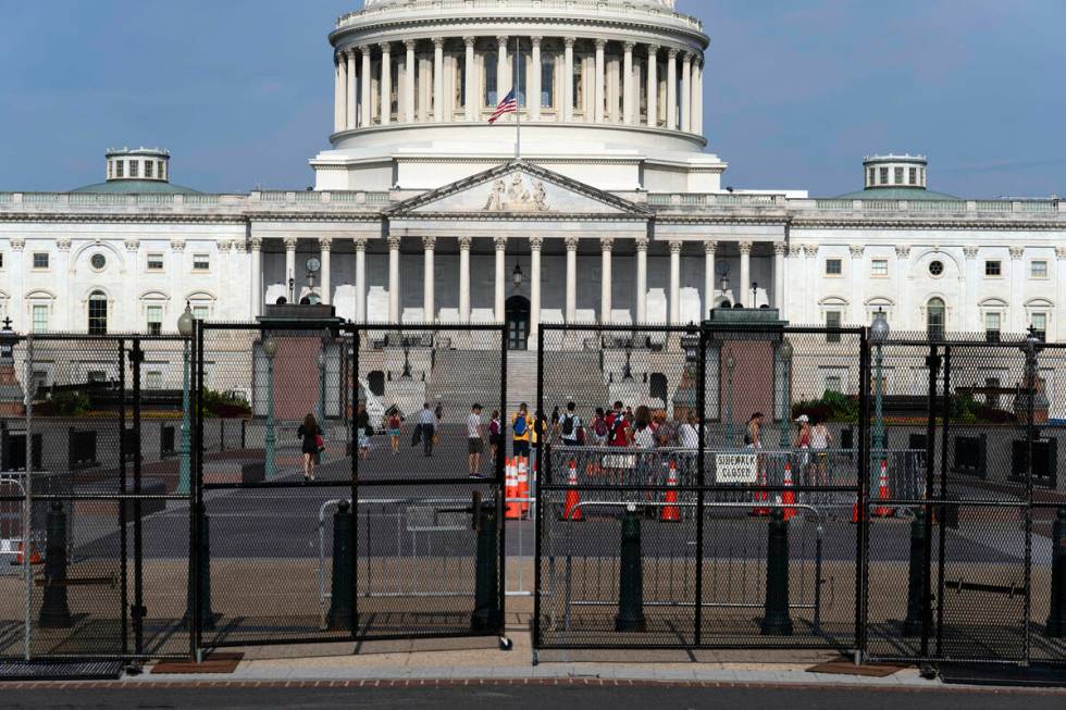 The U.S. Capitol is seen behind a security fence a day before of Israel's Prime Minister Benjam ...