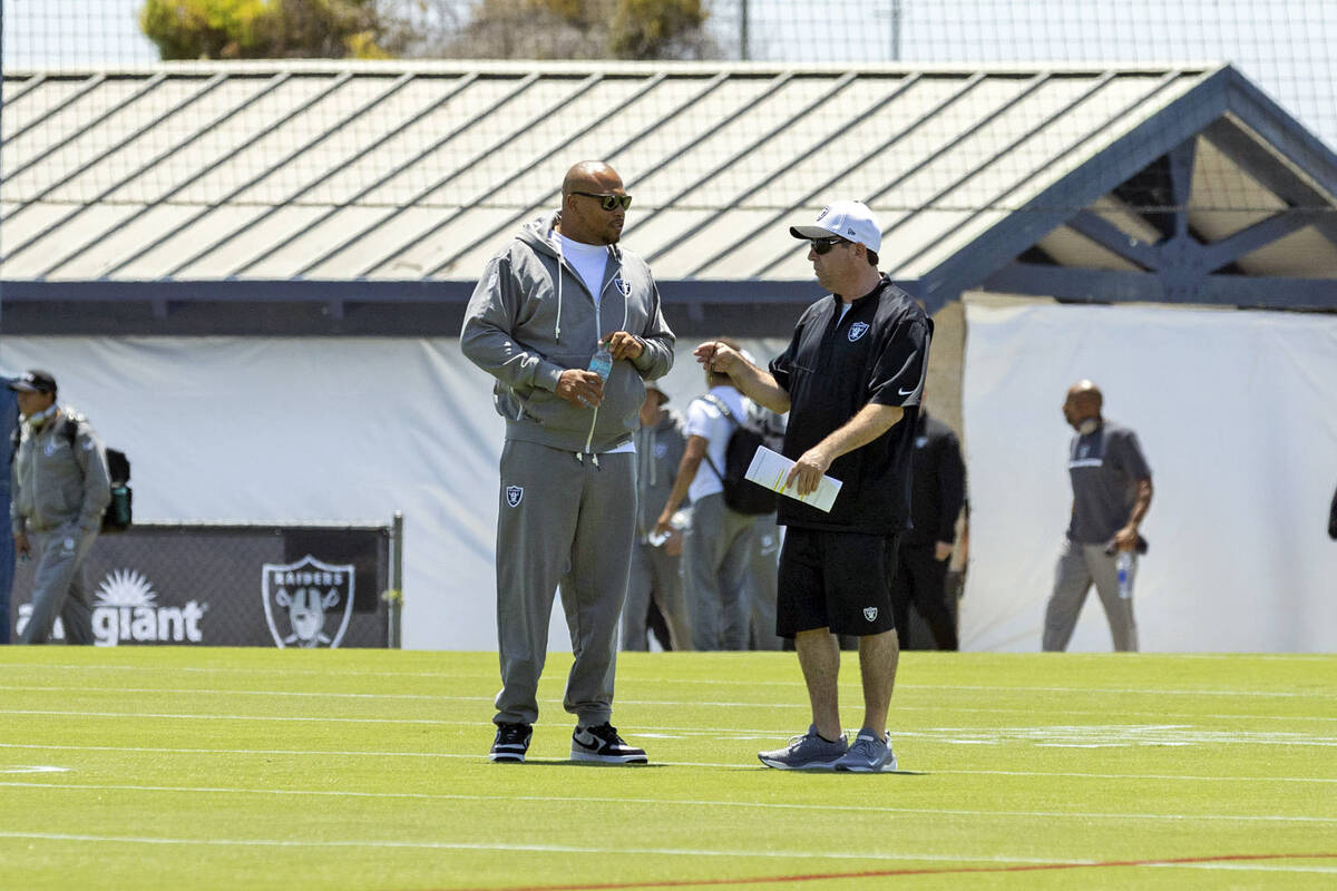 Raiders head coach Antonio Pierce, left, meets with Public Relations Director Will Kiss on the ...