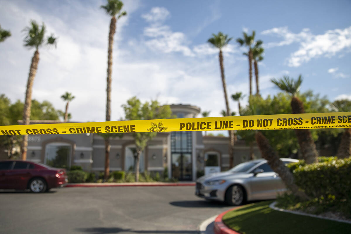 Police tape blocks the leasing office at The Clubs at Rhodes Ranch, Tuesday, July 23, 2024, in ...