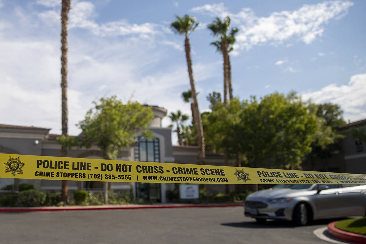 Police tape blocks the leasing office at The Clubs at Rhodes Ranch, Tuesday, July 23, 2024, in ...