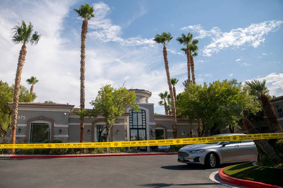 Police tape blocks the leasing office at The Clubs at Rhodes Ranch, Tuesday, July 23, 2024, in ...