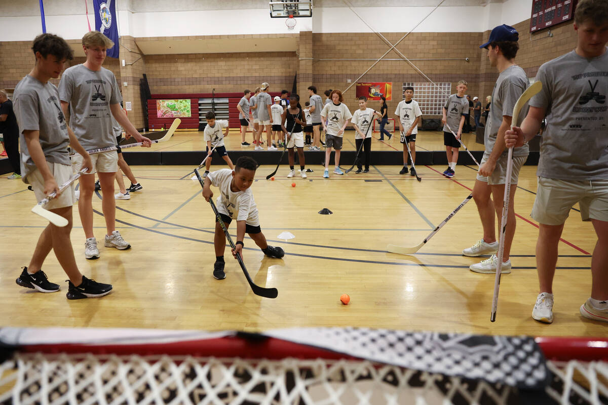 Local kids participate in a street hockey camp at the Veterans Memorial Community Center on Tue ...