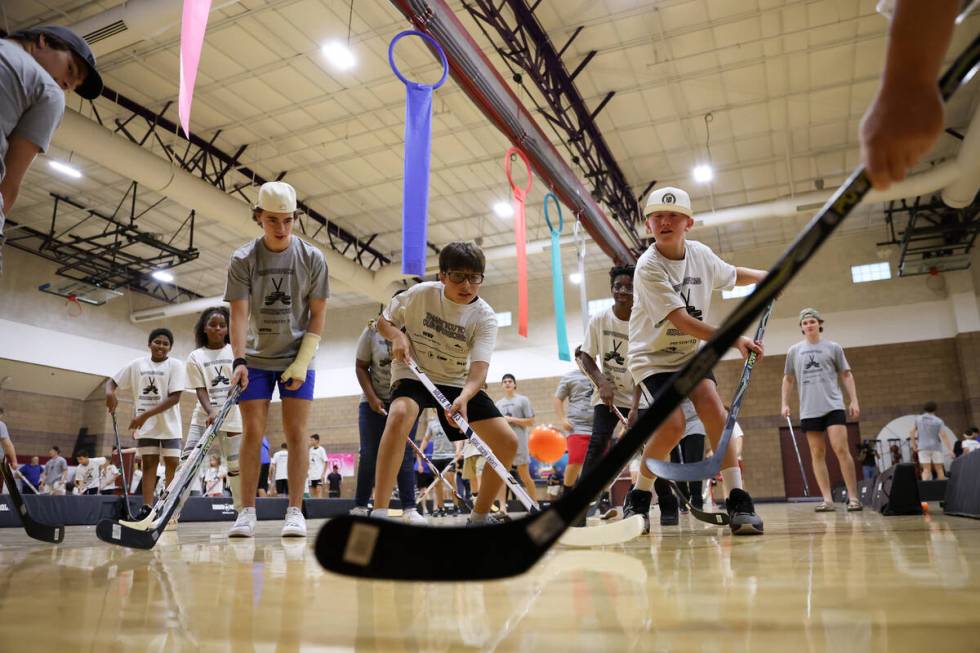 Local kids participate in a street hockey camp at the Veterans Memorial Community Center on Tue ...