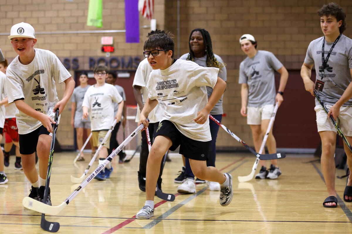 Local kids participate in a street hockey camp at the Veterans Memorial Community Center on Tue ...