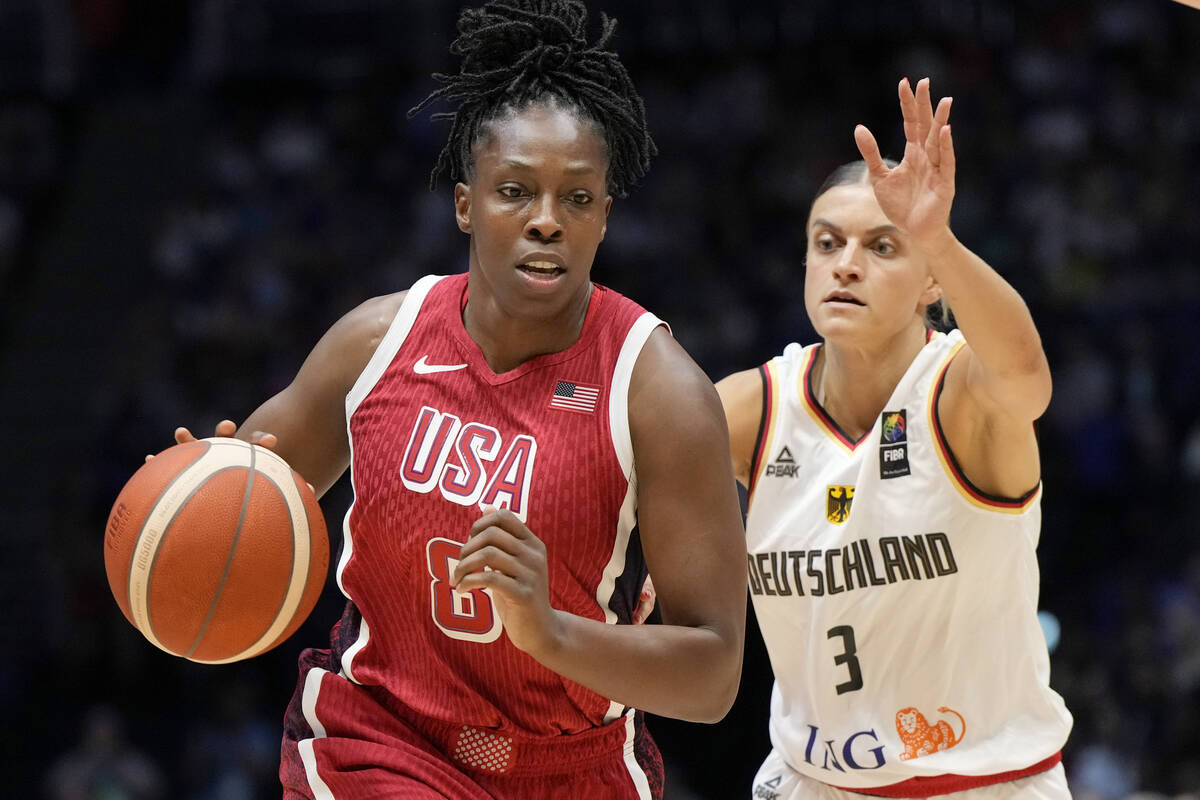 United States' Chelsea Gray, left, and Germany's Alexandra Wilke challenge for the ball during ...