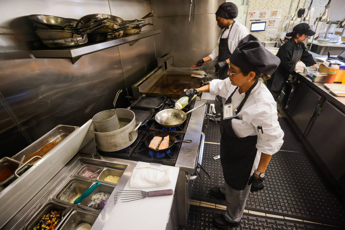 Students cook meals inside of the Westwide Bistro kitchen at the Culinary Academy of Las Vegas ...