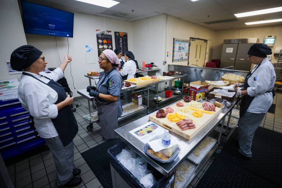 Letrice “Trice” Howard, middle, speaks to one of her students at the Culinary Academy of La ...