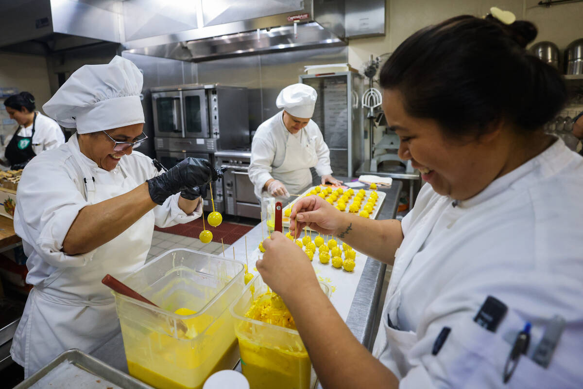 Students decorate sweets at the Culinary Academy of Las Vegas on Friday, July 19, 2024, in Nort ...