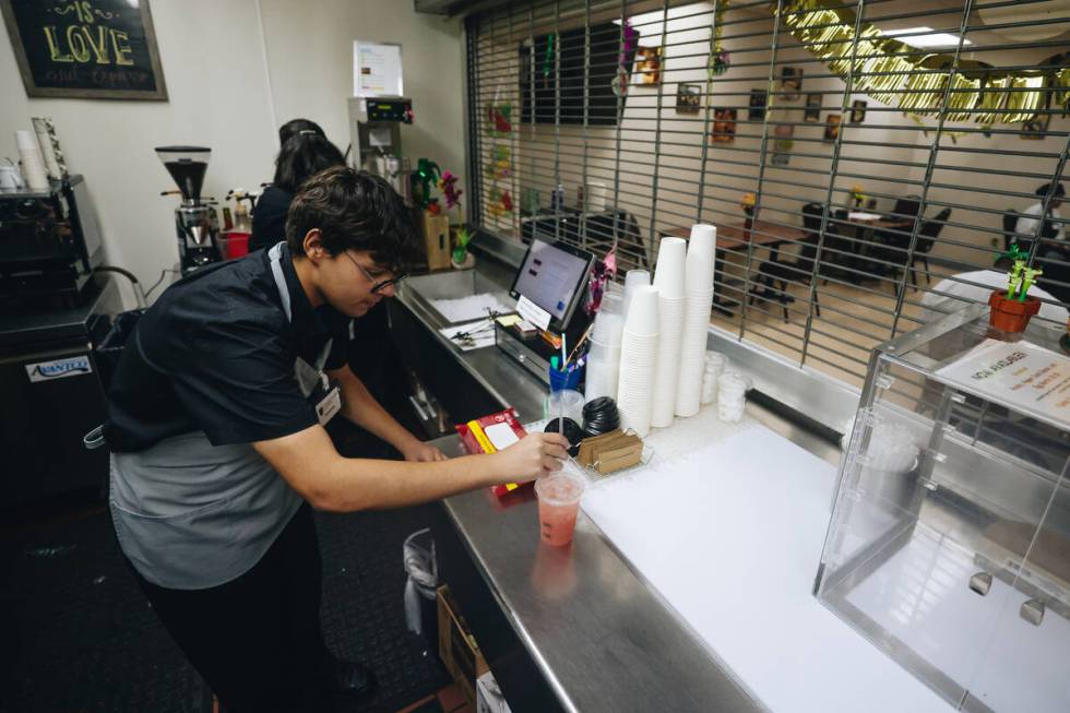 A student barista makes a drink at the Culinary Academy of Las Vegas on Friday, July 19, 2024, ...