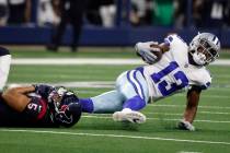 Dallas Cowboys wide receiver Michael Gallup (13) is stopped by Houston Texans safety Jalen Pitr ...