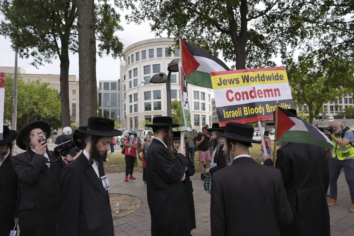 Hasidic Jews and others protest Israeli Prime Minister Benjamin Netanyahu's polices, near the U ...