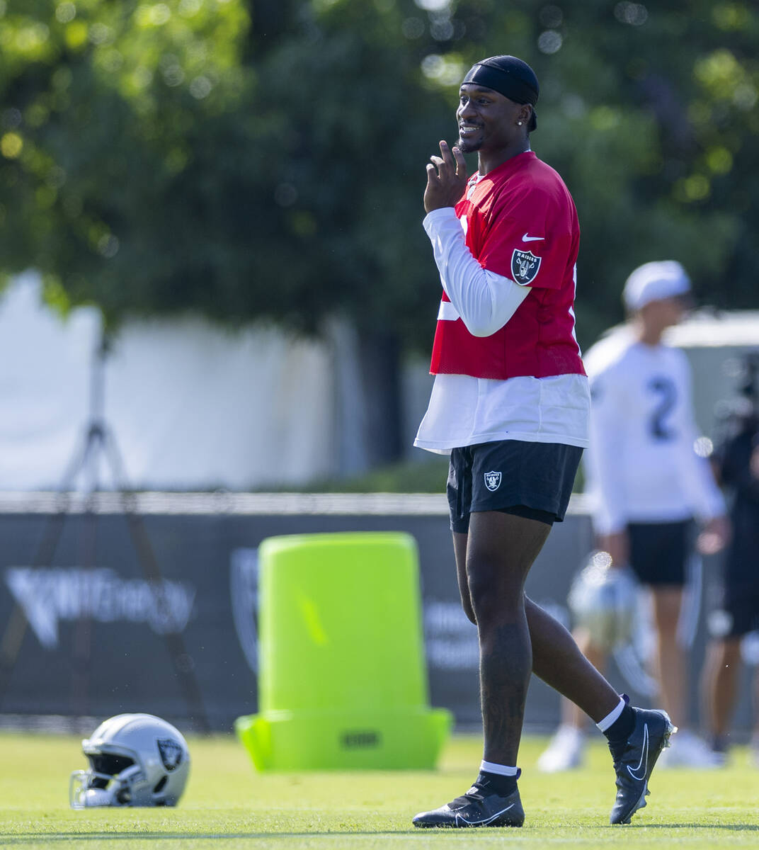 Raiders quarterback Anthony Brown, Jr., (13) looks to a teammate during the first day of traini ...