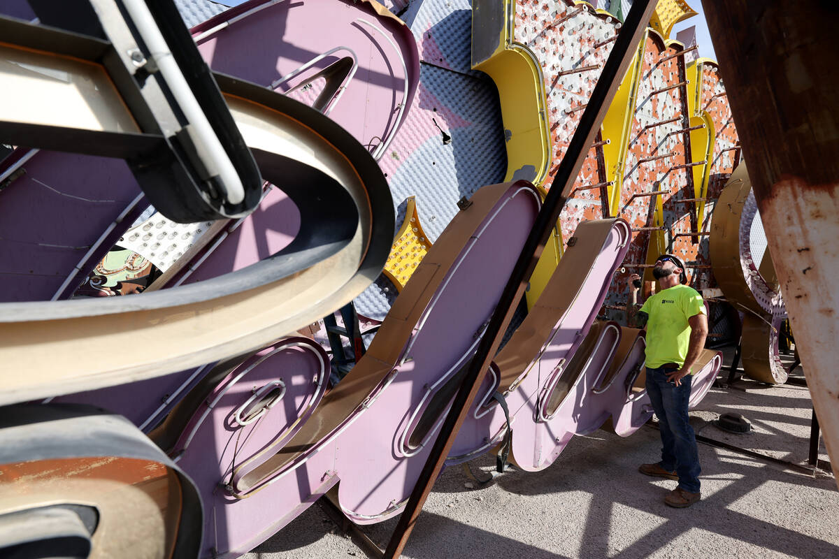 YESCO sign company workers prepare to move the cursive sign from the Debbie Reynolds Hollywood ...