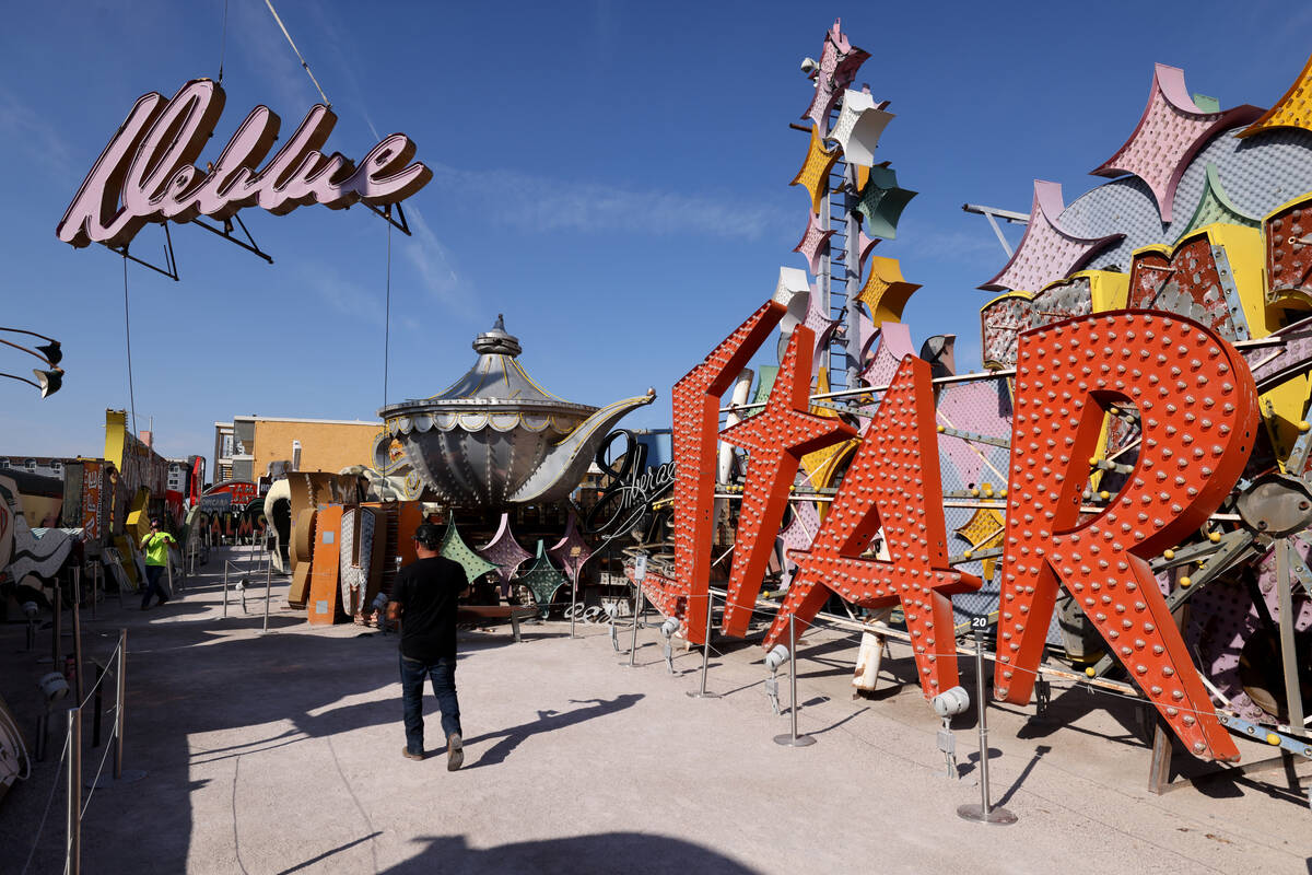 YESCO sign company workers move the cursive sign from the Debbie Reynolds Hollywood Hotel at th ...