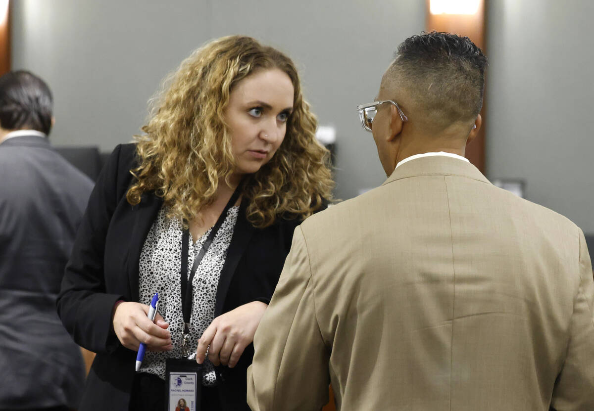 Attorney Rachel Howard, a public defender, listens to her client former Nevada Assemblyman Stev ...