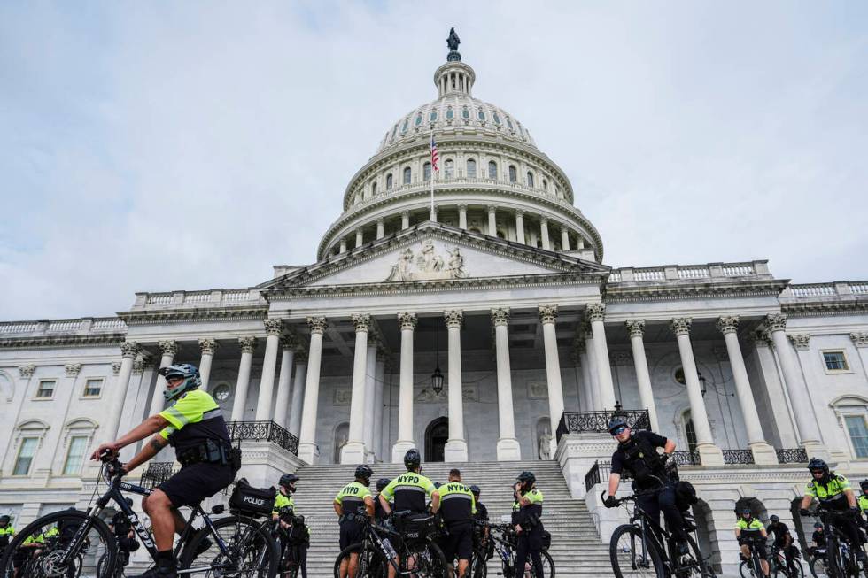 U.S. Capitol Police and NYPD officers stand in front of the Capitol ahead of Israeli Prime Mini ...