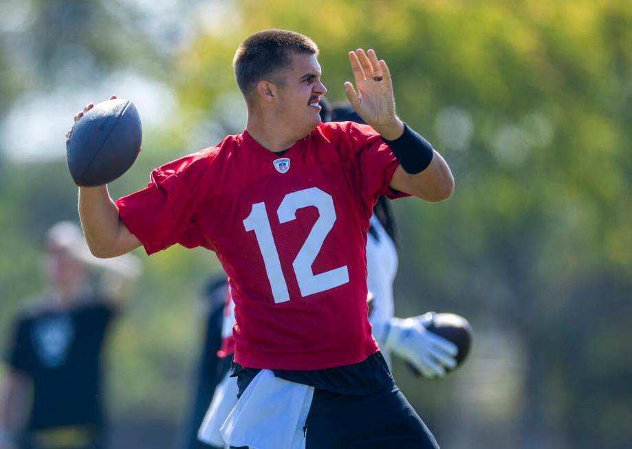 Raiders quarterback Aidan O'Connell (12) throws a pass during the second day of Raiders trainin ...