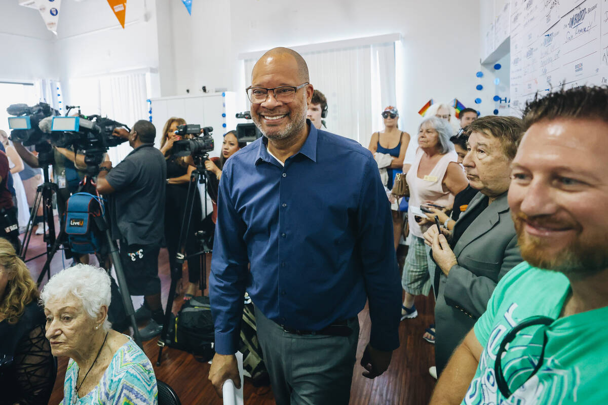 Nevada Attorney General Aaron Ford walks into a room to give a speech during an event to offici ...