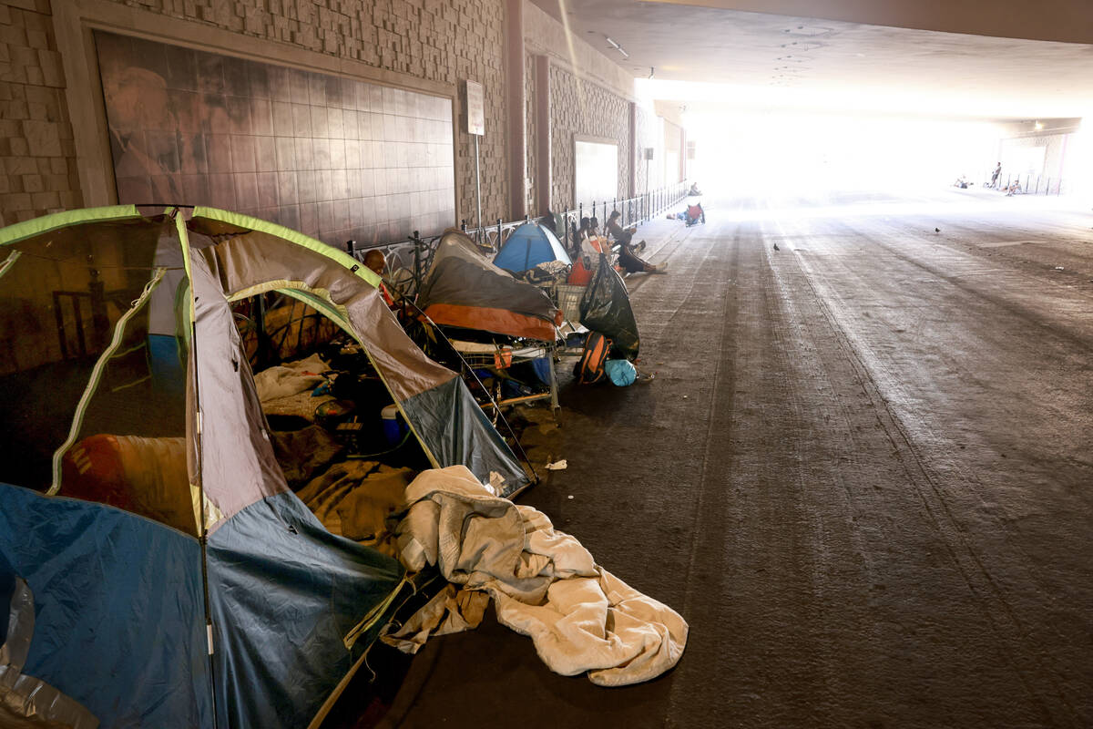 Tents are seen on F Street under Interstate 15 in Las Vegas Thursday, July 25, 2024. (K.M. Cann ...