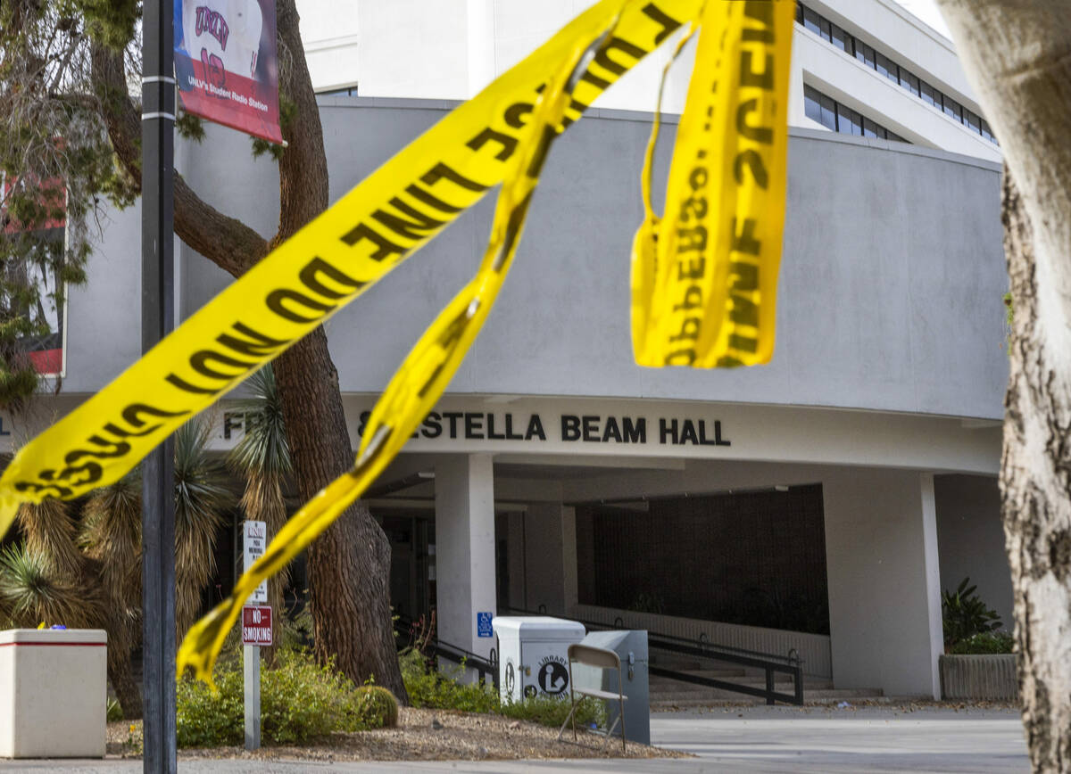 Police tape remains on a tree outside the entrance to the Frank and Estella Beam Hall following ...