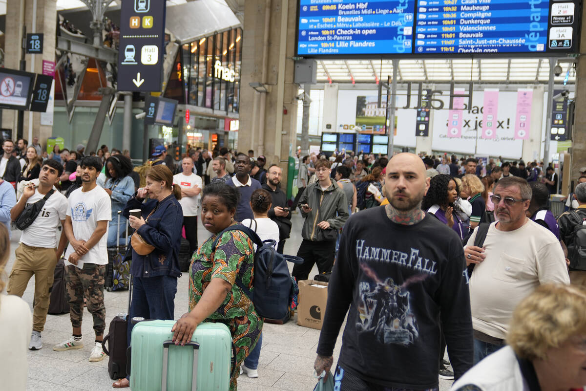 Travelers wait inside the Gare du Nord train station at the 2024 Summer Olympics, Friday, July ...