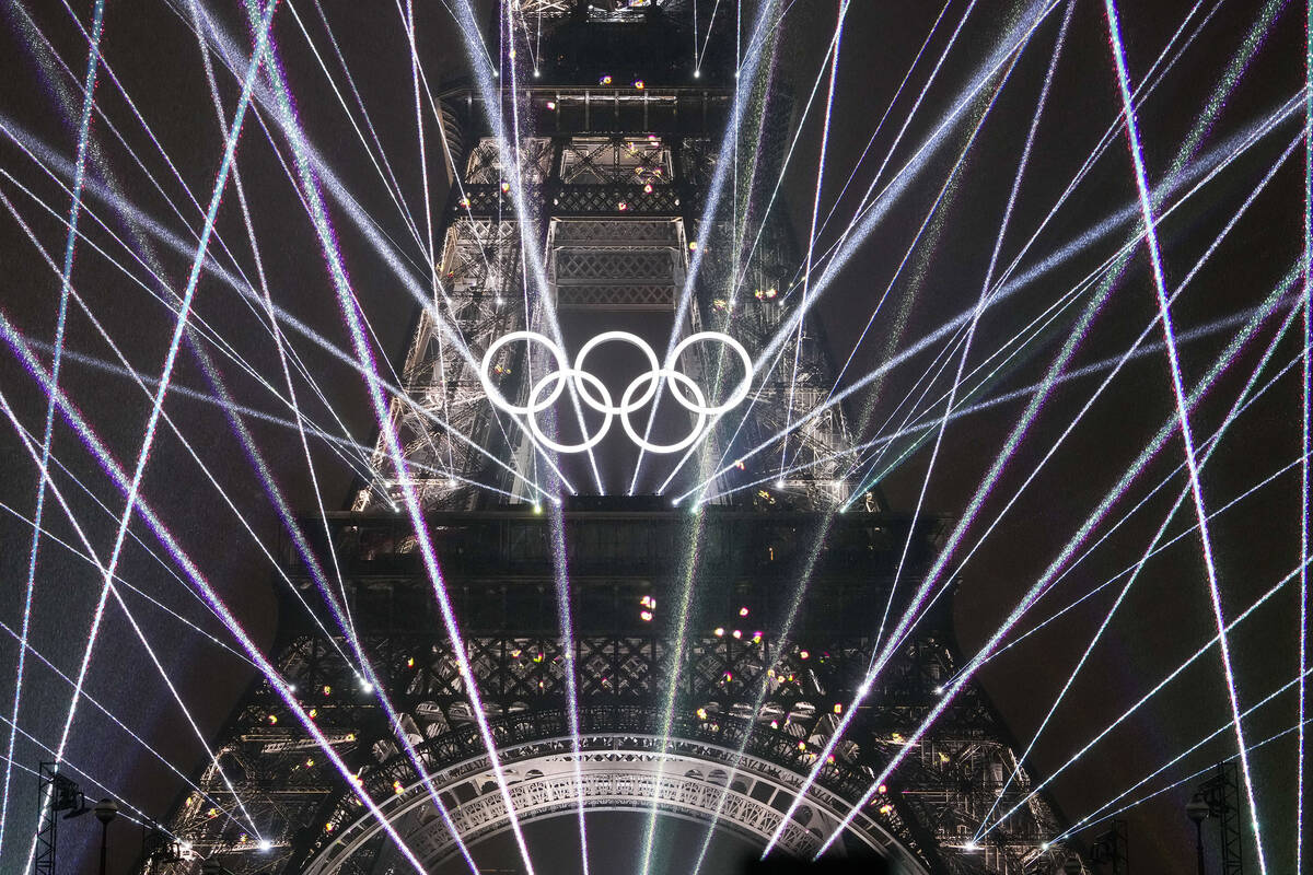 A light show is displayed on the Eiffel Tower during the opening ceremony of the 2024 Summer Ol ...