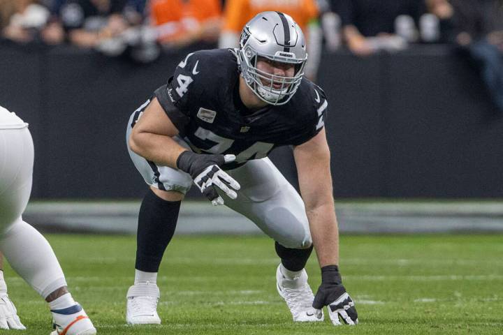 Raiders offensive tackle Kolton Miller (74) gets set on the line of scrimmage during the first ...