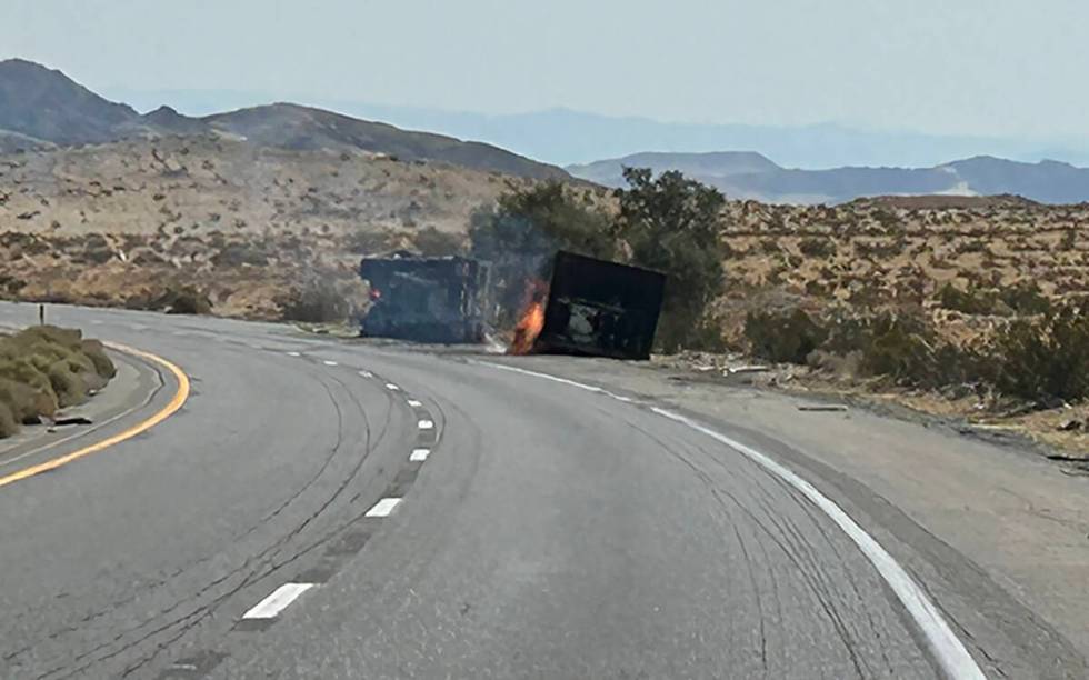A truck carrying lithium ion batteries burns along Interstate 15 near Barstow, California, on F ...