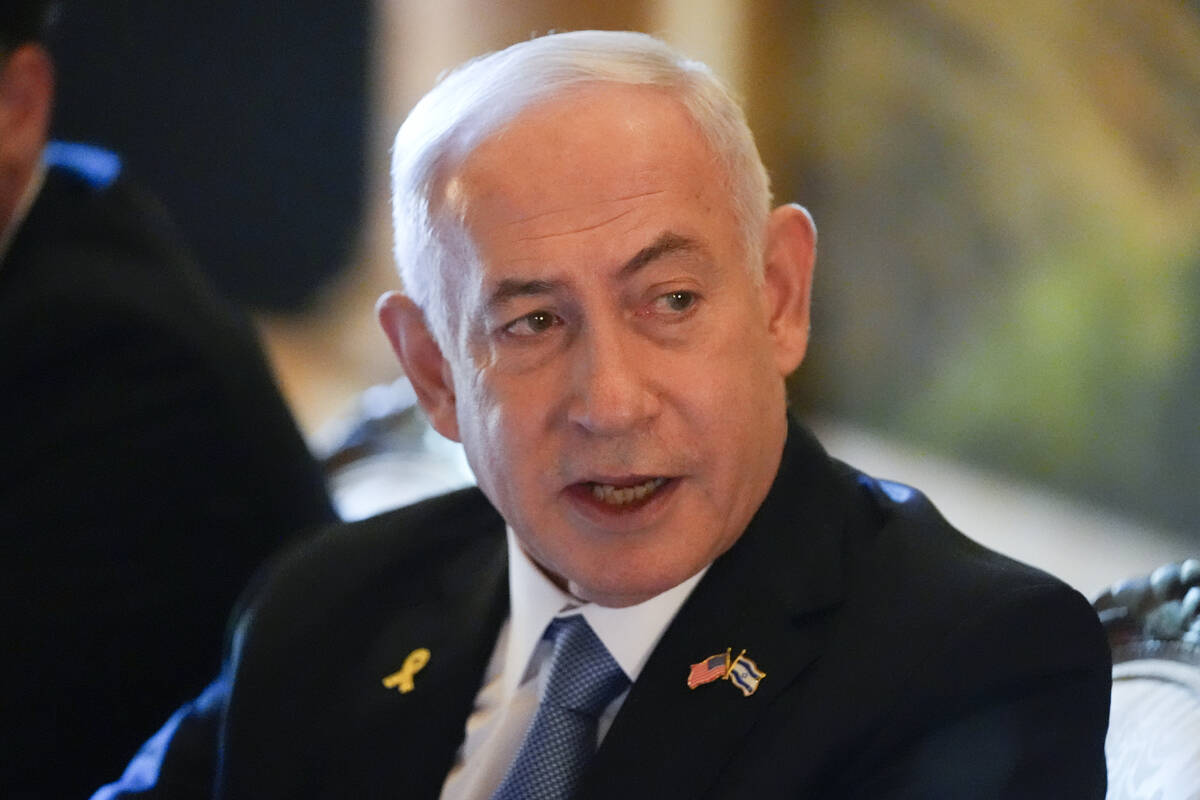 Israeli Prime Minister Benjamin Netanyahu speaks while meeting with Republican presidential can ...