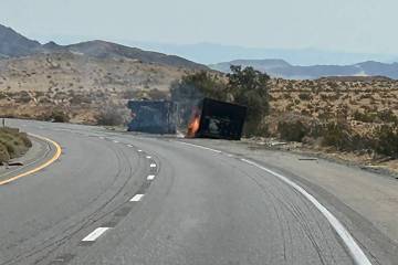 A truck carrying lithium ion batteries burns along Interstate 15 near Barstow, California, on F ...