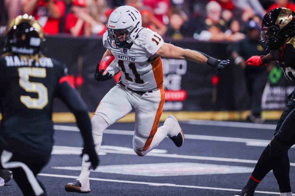 Arizona Rattlers quarterback Dalton Sneed (11) runs the ball during a playoff game between the ...