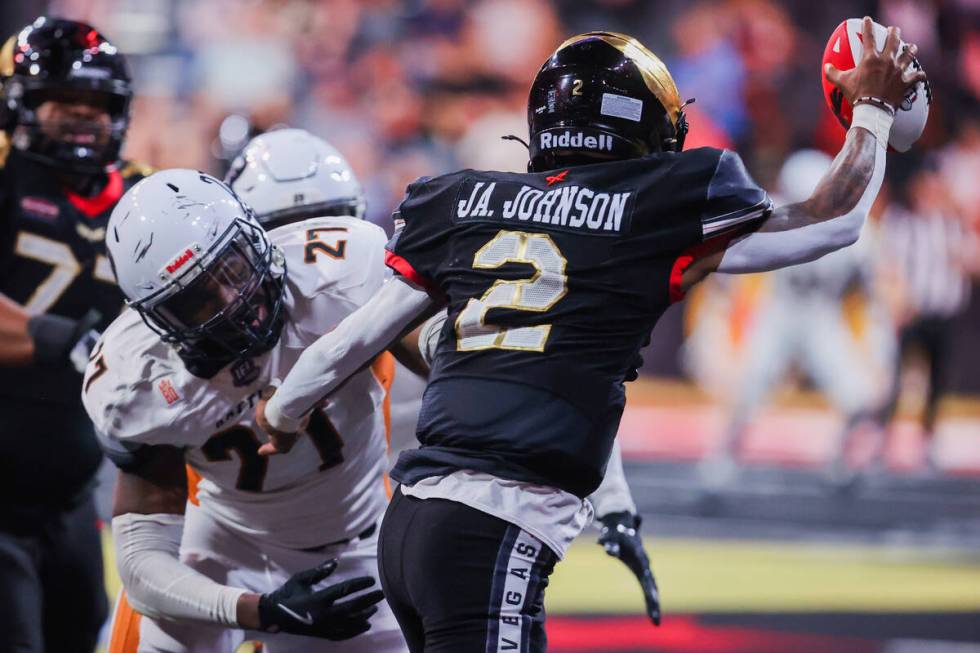 Knight Hawks quarterback Ja’Rome Johnson (2) passes the ball to a teammate as Rattlers d ...