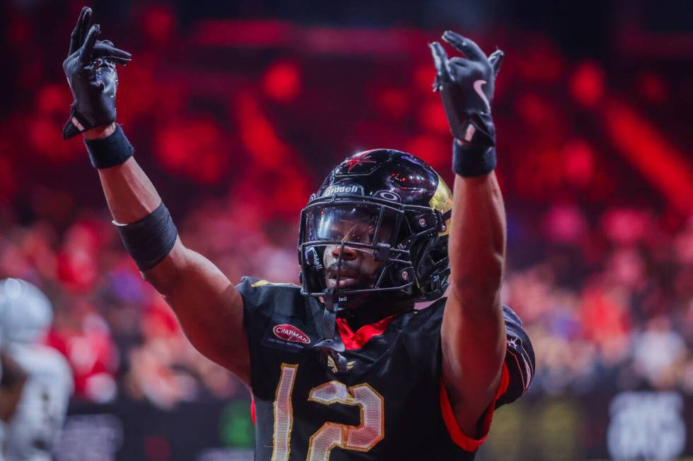 Knight Hawks defensive back James Caesar (12) celebrates a Knight Hawks touchdown during a play ...