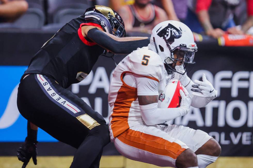 Arizona Rattlers defensive back Jarmaine Doubs (5) keeps hold of the ball during a playoff game ...