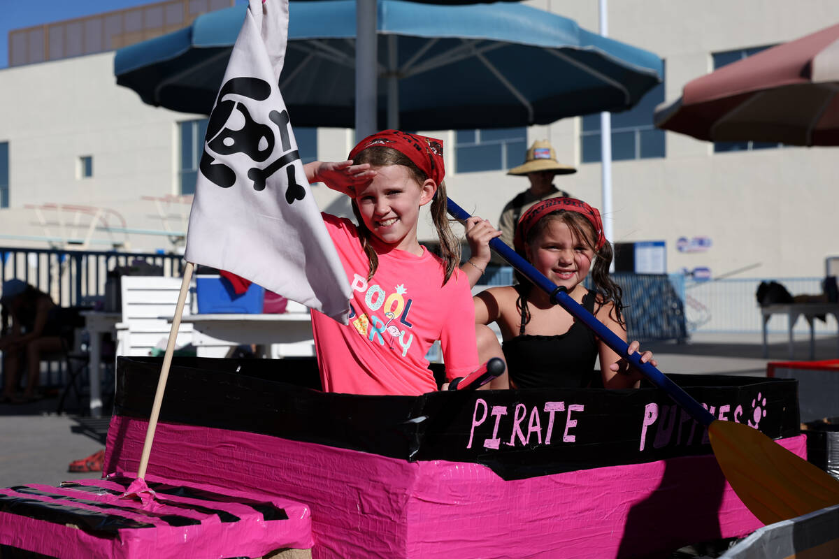 Madison Milton, left, and Brooklyn Schubert, both 8 years old, pose in their handmade vessel du ...