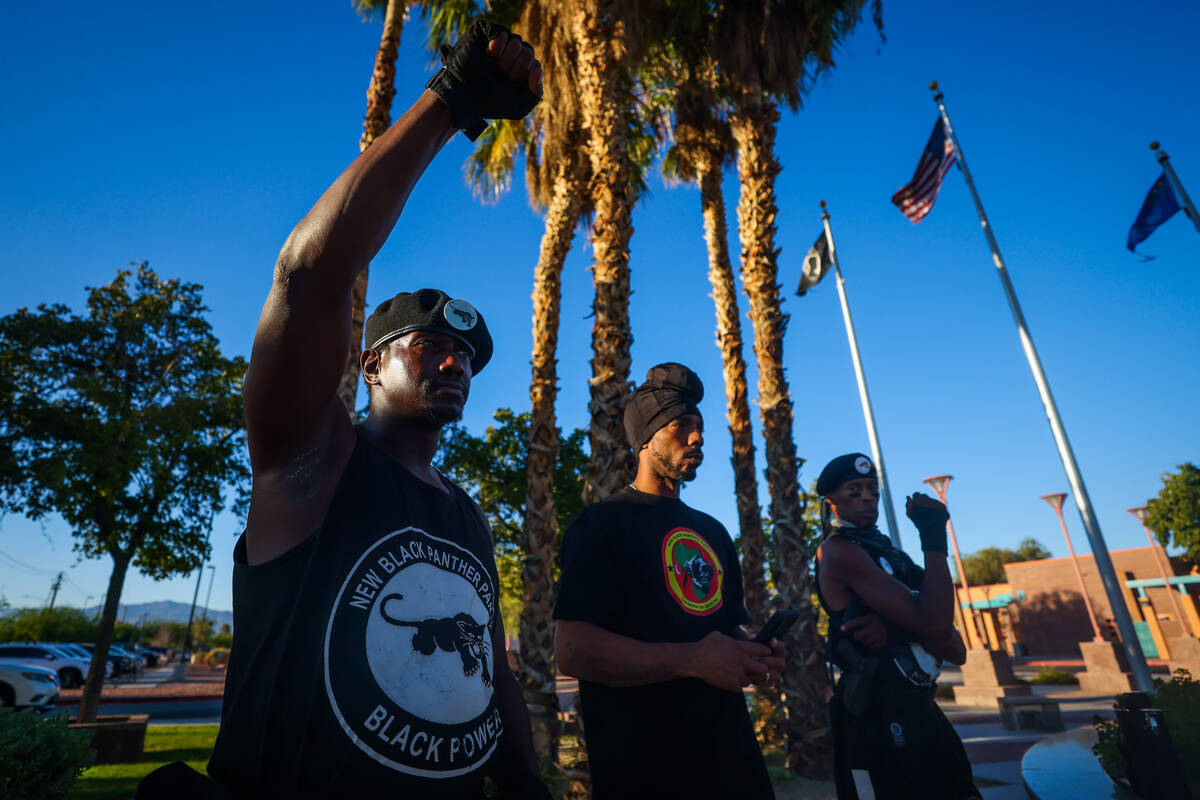 A member of the New Black Panther Party raises a fist during a vigil for Sonya Massey, a Black ...