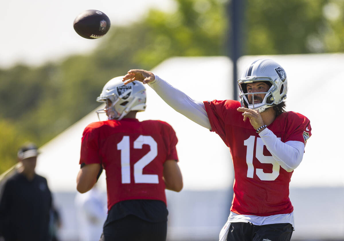 Raiders quarterback Gardner Minshew (15) gets off a pass during the third day of Raiders traini ...