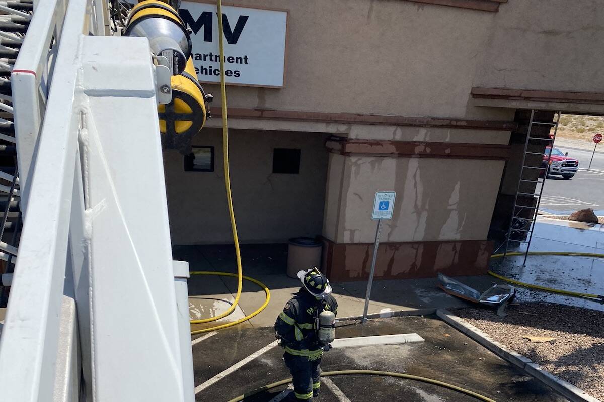 Member of the Pahrump Valley Fire and Rescue extinguishing a fire at the Pahrump DMV office on ...