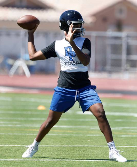 Desert Pines quarterback Keyshawn Martin prepares to throw the ball during the first day of hig ...