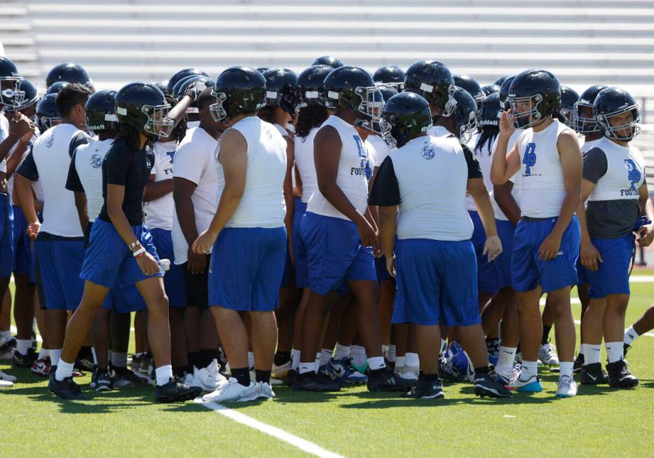 Desert Pines players huddle before the first day of high school football practice, on Monday, J ...