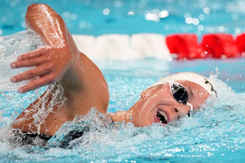 Katie Grimes, of the United States, competes during a heat in the women's 1500-meter freestyle ...