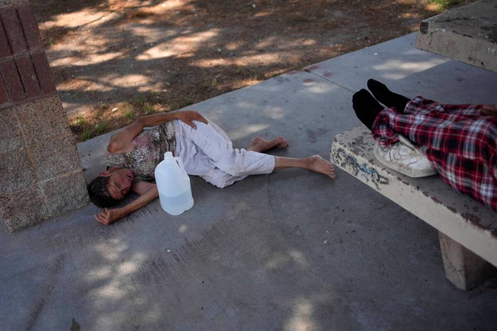 Deb Billet, 66, lies on the ground while Henderson Public Response officers call an ambulance t ...