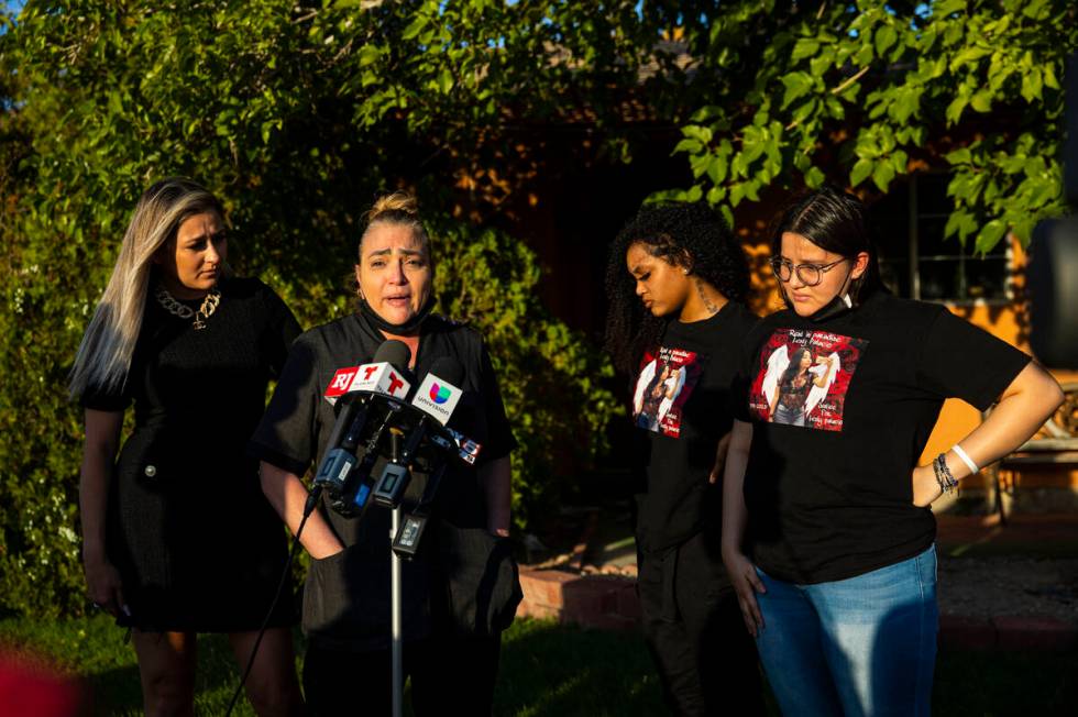 Aracely Palacio, second from left, is comforted by attorney Ofelia Markarian while speaking dur ...